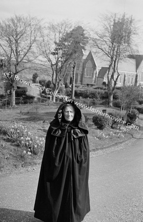 HOODED CLOAK ( MRS O'LEARY) AT PAROCHIAL HOUSE